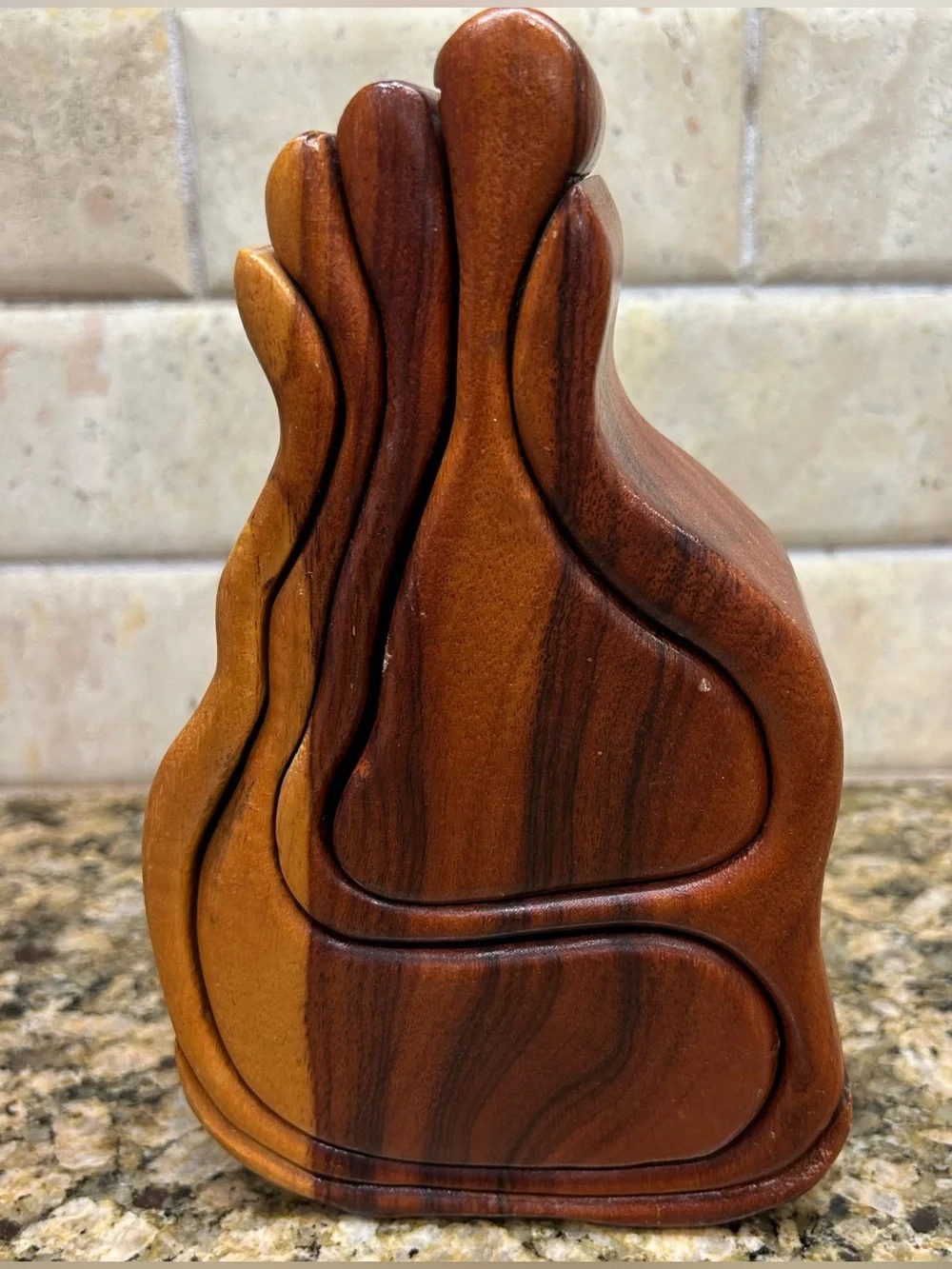 Wooden bandsaw puzzle box with two felt lined secret compartments that slide out